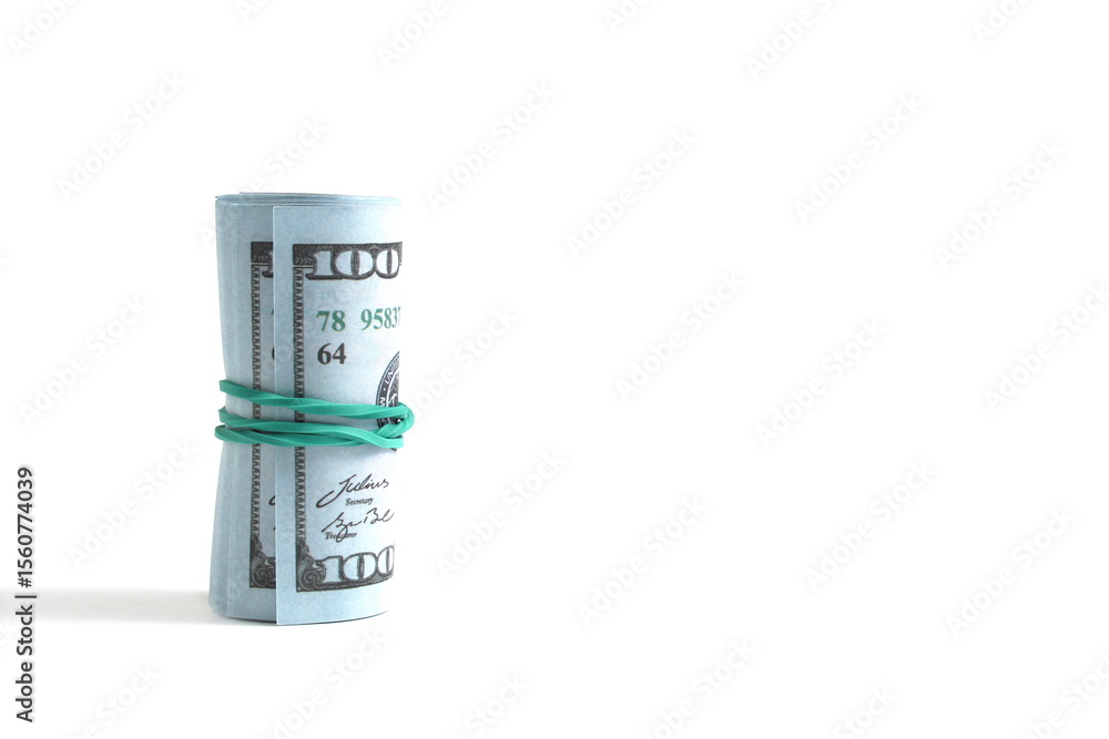 Dollar bills tied with a rubber band lie on a white background. Dollar bills tied with a rubber band lie on a white background.
