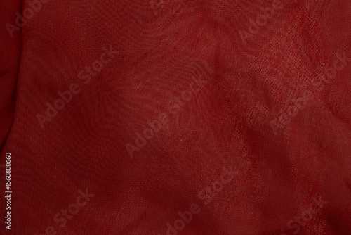 Fotografie Close-up of red fabric texture with soft folds