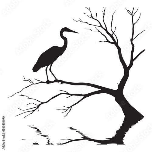 Silhouette of a heron perched on a bare tree branch with reflection in water
