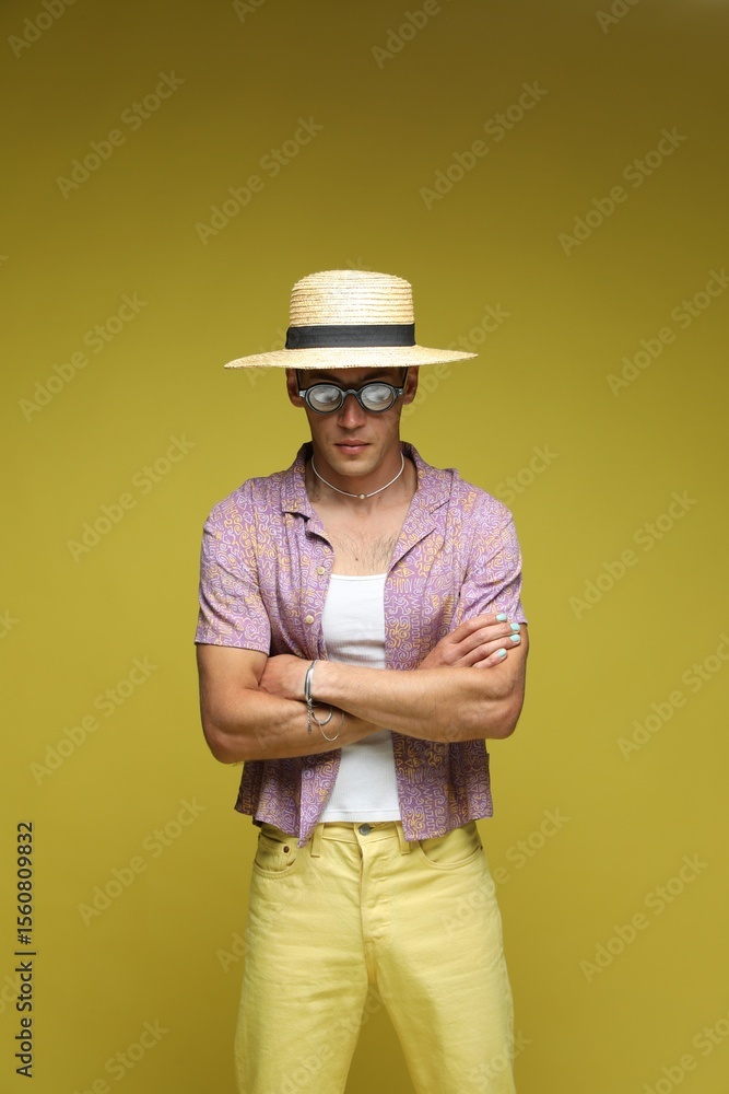 Fashionable portrait of handsome man in stylish outfit on color background Fashionable portrait of handsome man in stylish outfit on color background