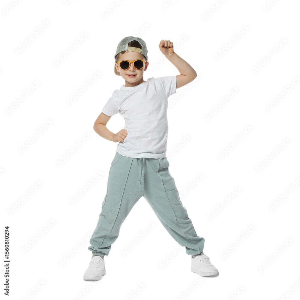 Happy little boy in sunglasses and baseball hat dancing on white background Happy little boy in sunglasses and baseball hat dancing on white background
