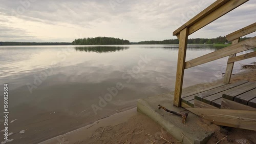 Experience the calm and beauty of Porvoo, Finland as spring unfolds. The gentle waves lap against the sandy shore, inviting relaxation and tranquility in nature’s embrace.	