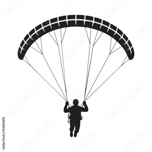 Black silhouette of person paragliding white
