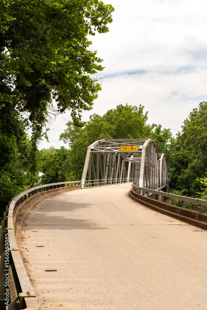 Fototapeta premium Devils Elbow, Missouri, USA - June 17th 2025 - The historic 1923 Devils Elbow Bridge over the Big Piney River on Route 66.