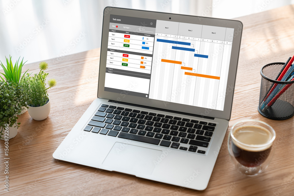 Project planning software for modish business project management on the computer screen showing timeline chart of the team project Project planning software for modish business project management on the computer screen showing timeline chart of the team project