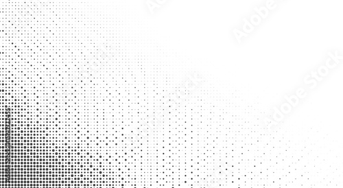 Abstract background with a gradient of black dots of varying sizes on white
