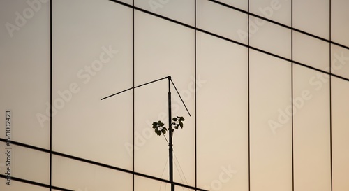 Abstract architectural detail with linear patterns and reflections against a soft background suggesting design and structural elements. A minimal, geometric composition.