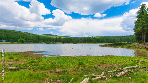 Summer Landscape of Odell Lake in Mund's Park surrounded by forest near Flagstaff, Arizona - monsoon clouds building in Northern Arizona