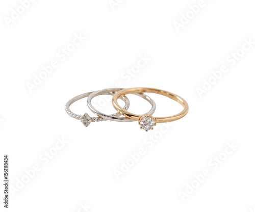 Wallpaper Mural Exquisite Trio, A Captivating Close-Up of Silver and Gold Rings Adorned with Sparkling Gemstones Showcasing Delicate Craftsmanship Torontodigital.ca