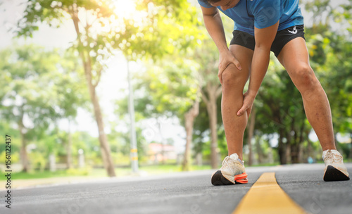 Photography Runner Leaning Over with Leg Discomfort During Jog