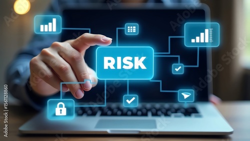 A business professional interacts with digital risk management icons on a laptop screen, symbolizing data security and analysis.