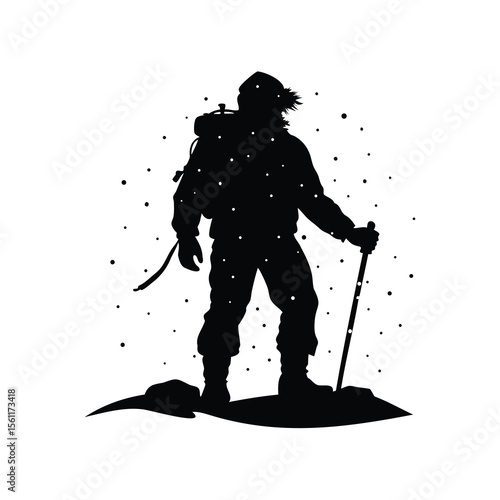 A silhouette of a mountaineer standing in snowy conditions with walking stick