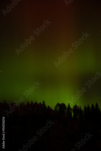 Spectacular displays of shimmering light from Aurora Borealis in the night sky. It was an amazing display of the Northern Lights