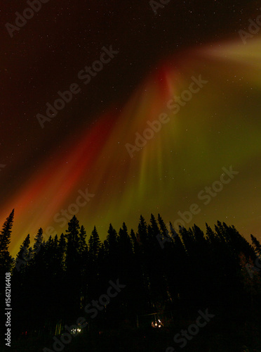 Spectacular displays of shimmering light from Aurora Borealis in the night sky. It was an amazing display of the Northern Lights