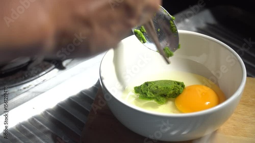 Chef cooking Super food. An omelet with Wolffia globosa, the nutrient rich plant. High quality plant protein, omega 3 and vital minerals. 