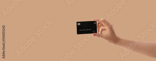 Hand holding credit card on...