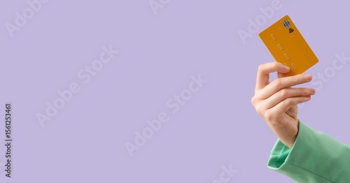 Hand holding credit card on...