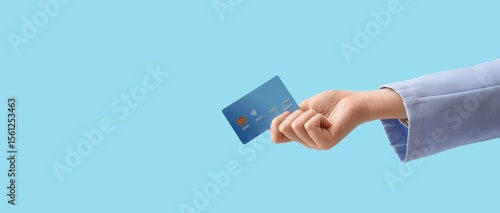 Hand holding credit card on...