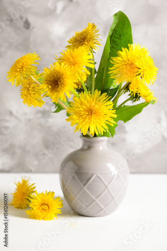 Vase with beautiful dandeli...