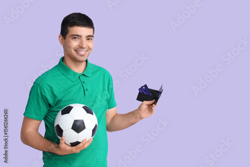 Happy young man with soccer...