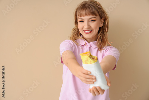 Young woman with tasty sand...