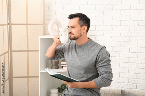 Handsome man with coffee cu...