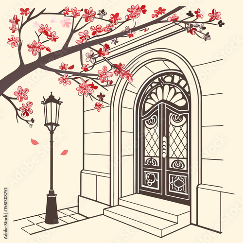 a tree branch with pink flowers and a door
