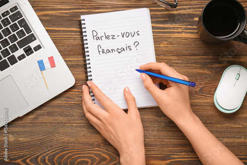 Woman writing in French, mo...