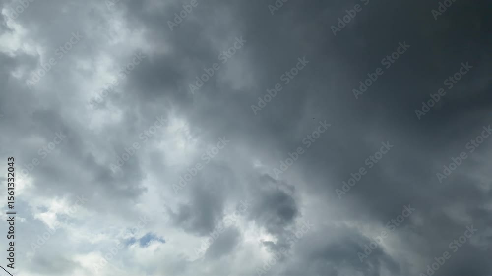 Time lapse 4K of moving dark rain storm clouds flowing in the sky in bad day Time lapse 4K of moving dark rain storm clouds flowing in the sky in bad day