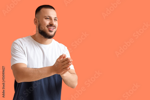 Thankful young man pressing...