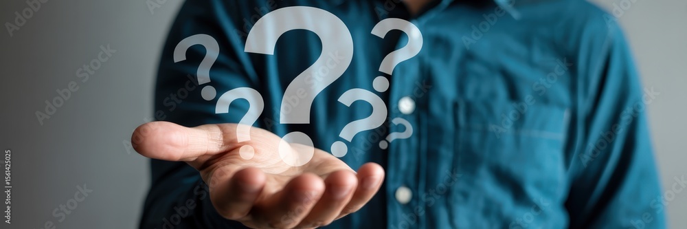 Hand holding numerous question marks. Hand holding numerous question marks.