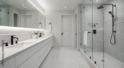 Sleek modern bathroom with marble tiles, elegant fixtures, and bright illuminated interior design