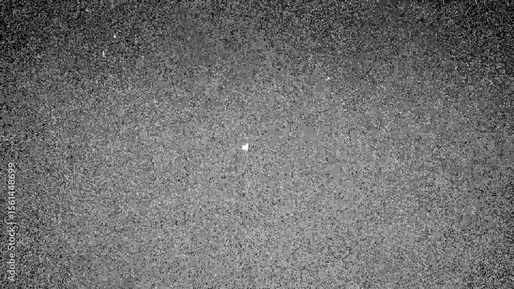 Obraz premium Grayscale Asphalt Texture with Speckled Surface and Subtle Light Spot