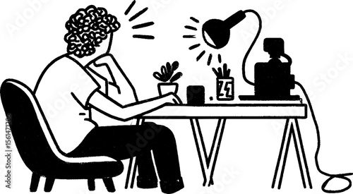 Person setting up livestream equipment with lamp and camera on desk