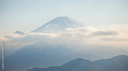 Majestic Mount Fuji: Snow-Capped Peak Emerging from Cloudscape in Japan