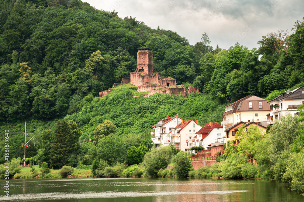 Fototapeta premium beautiful landscape of mountain village and ruins of an old castle on a cloudy day