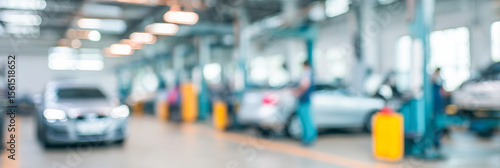 Wallpaper Mural Busy car service centre with mechanics working in a dimly lit auto repair workshop Torontodigital.ca