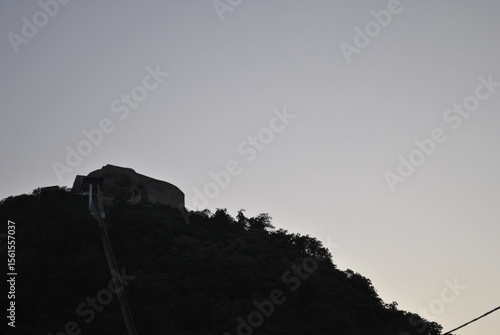 silhouette of a man on a rock