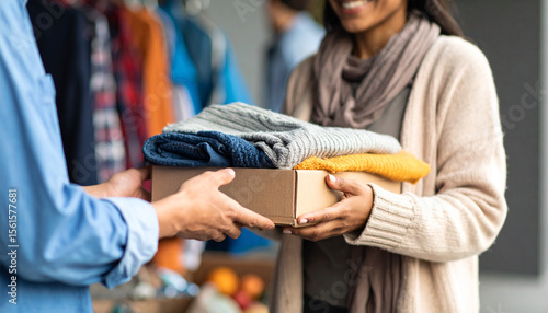 Help or hands with donation for homeless person, without visible face; concept of helping and care