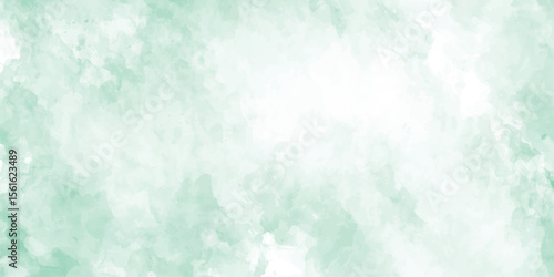Vászonkép A soothing green watercolor background with soft brush textures blending into wh