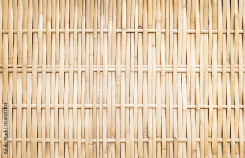 old grungy thai handcraft of bamboo weave pattern fence.