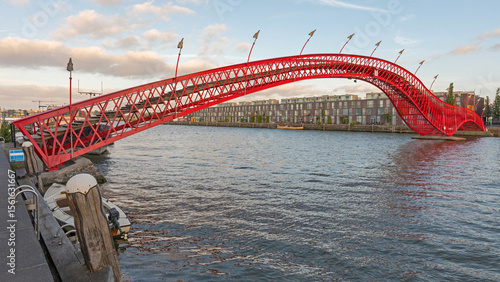 Photography Red Python Bridge Over Water Canal at Eastern Docklands in Amsterdam Netherlands