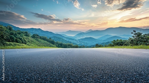 Asphalt road square and green mountain with sky clouds natural landscape at dusk. car background.
