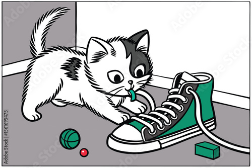 Mischievous kitten playing with shoelaces in a playful pose