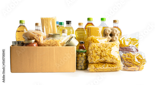 Foodstuff for donation, storage and delivery. Various food, pasta, cooking oil and canned food in cardboard box.