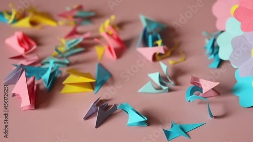 summer paper craft for kids. create art for children bouquet of flowers for mother's day. scraps of colored paper on pink background.