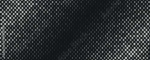 Halftone pattern background featuring white dots evenly distributed on a solid black surface. Classic pop art style suitable for graphic design, posters, and digital artwork.
