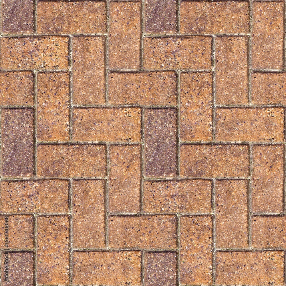 Fototapeta premium Brick herringbone pattern - Repeating masonry paving typically found in developed areas. Often seen in towns, patios and driveways. Seamless background texture to tile with tan brown color.