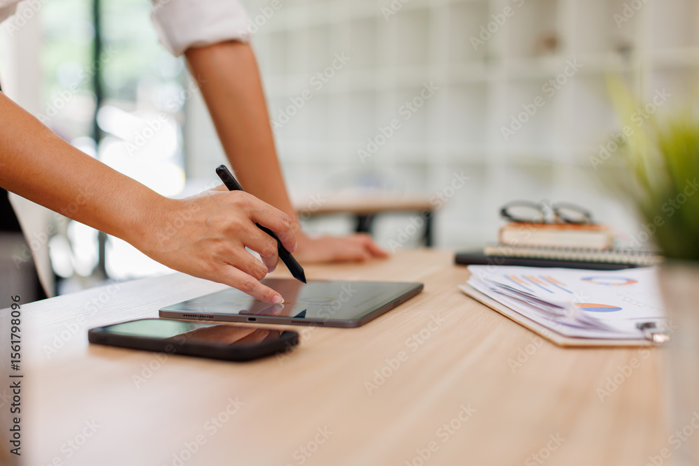 Fototapeta premium Business asian woman financial expert analyzes business report graph and chart at the office. Concept of financial economy and marketing research. 