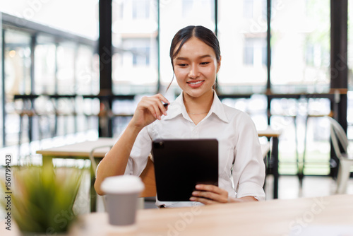 Free Download Young asian business woman manager accounting analyst checking bills, analyzing sales statistics management, taxes financial data documents or marketing report papers working in office using laptop.  - GFXLoad